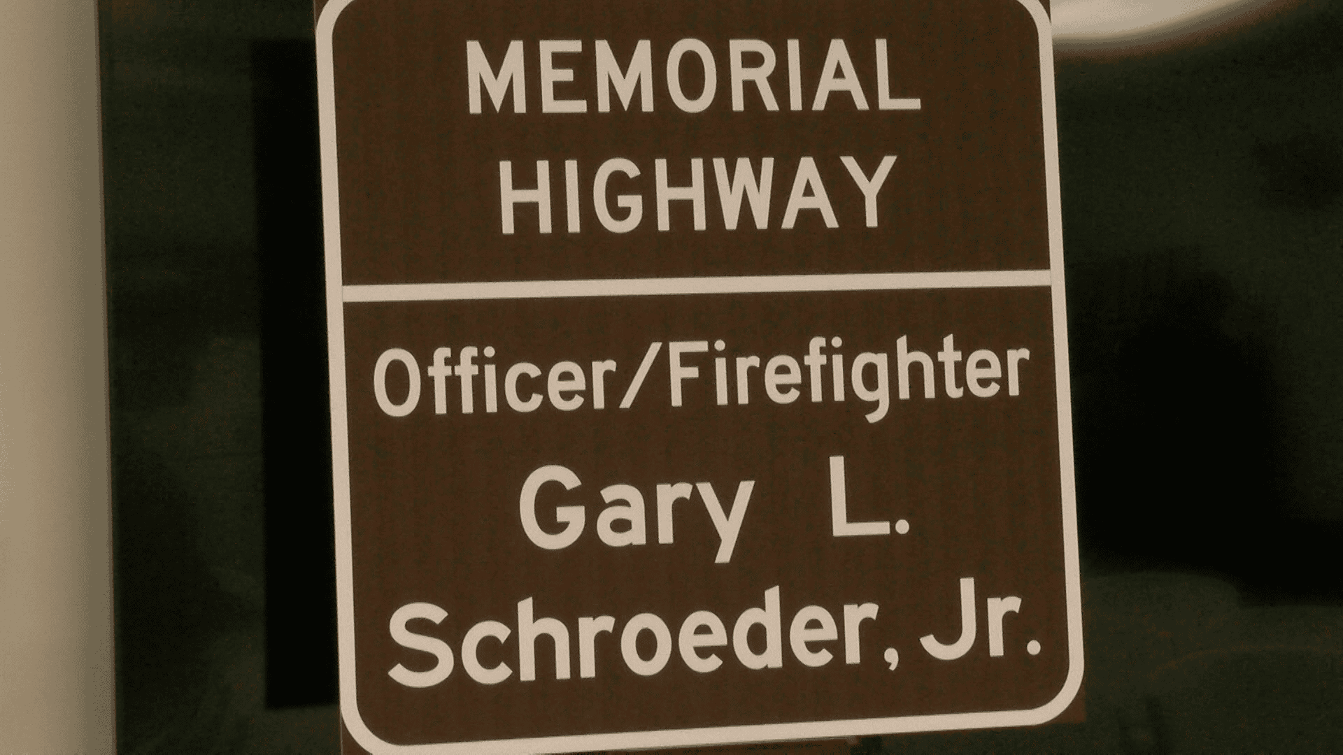 Memorial highway sign honoring Officer and Firefighter Gary L. Schroeder Jr.